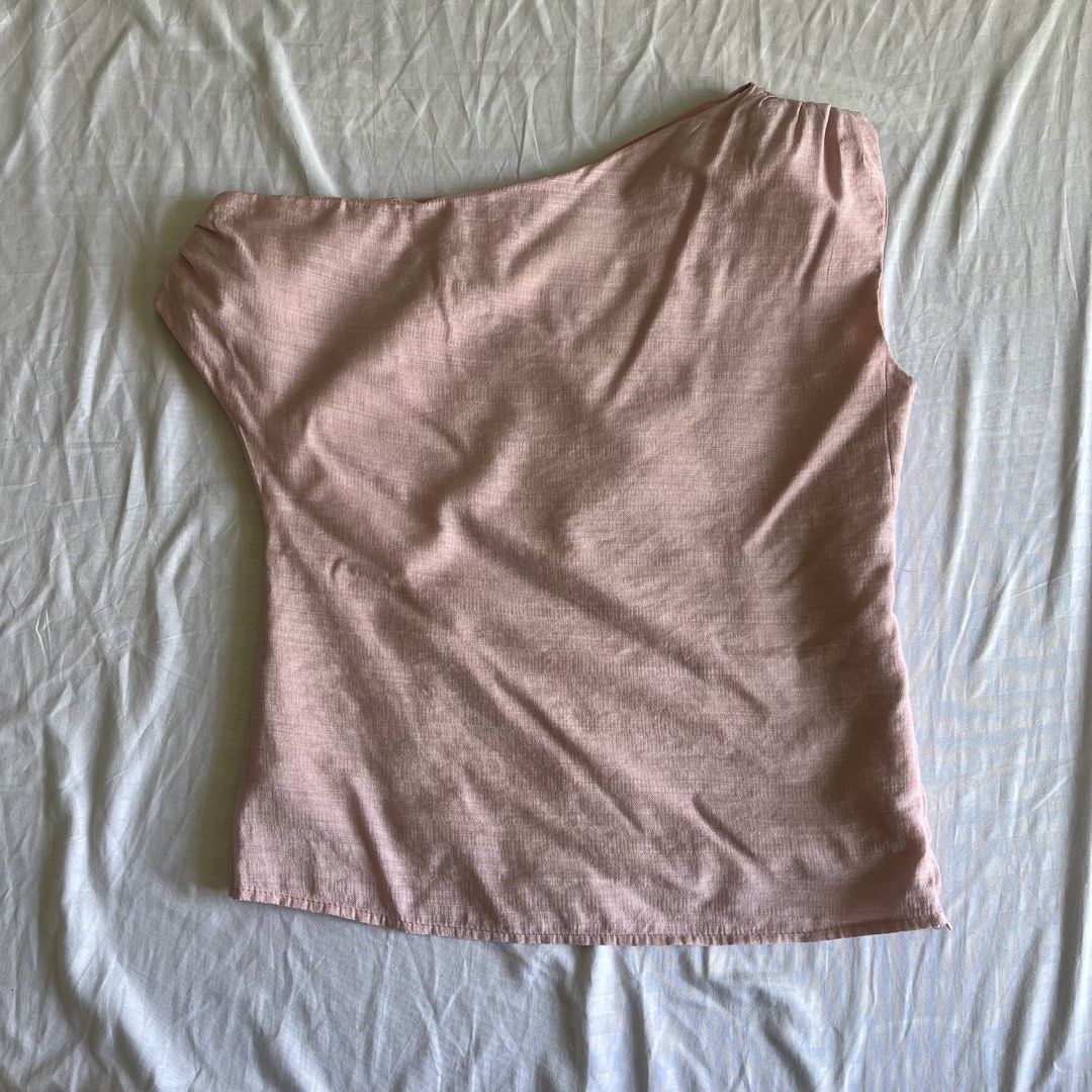 Pink Linen Off-the-Shoulder Blouse (Category: Blouses) located in Caloocan City. Submitted by daenty.mnl (Listing ID 1462469198, Image 2). Description: - used once only - bought for ₱1000 - Sheer linen fabric - Trendy off-the-shoulder design - Unique one-sleeve style - Flattering belted waist - Effortlessly feminine - Perfect for dressing up or down - Pairs beautifully with skirts or pants.