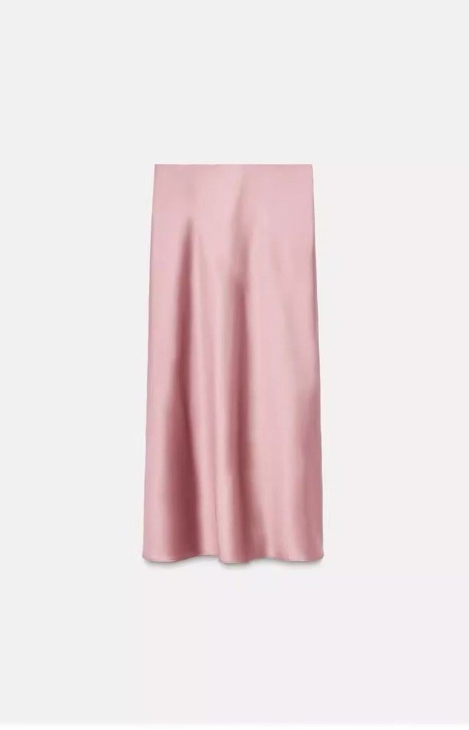 Pink Satin Midi Skirt (Category: Skirts) located in Manila. Submitted by chreestn (Listing ID 1462610705, Image 2). Description: - Flowy satin midi skirt - Pretty pink shade - Slight sheen, drapes beautifully - Versatile: dress up or down - Perfect for night out or casual day - Easy to style with various tops and shoes.