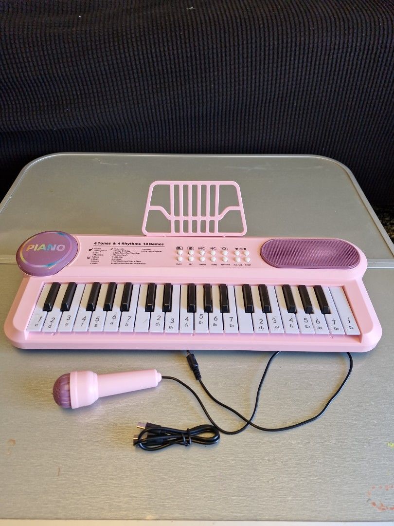 Pink toy keyboard (Category: Kids Toys) located in Quezon City. Submitted by declttermum (Listing ID 1462451566, Image 1). Description: Preloved pink piano toy. Tested working, missing stand only. Wysiwyg. Available by December..