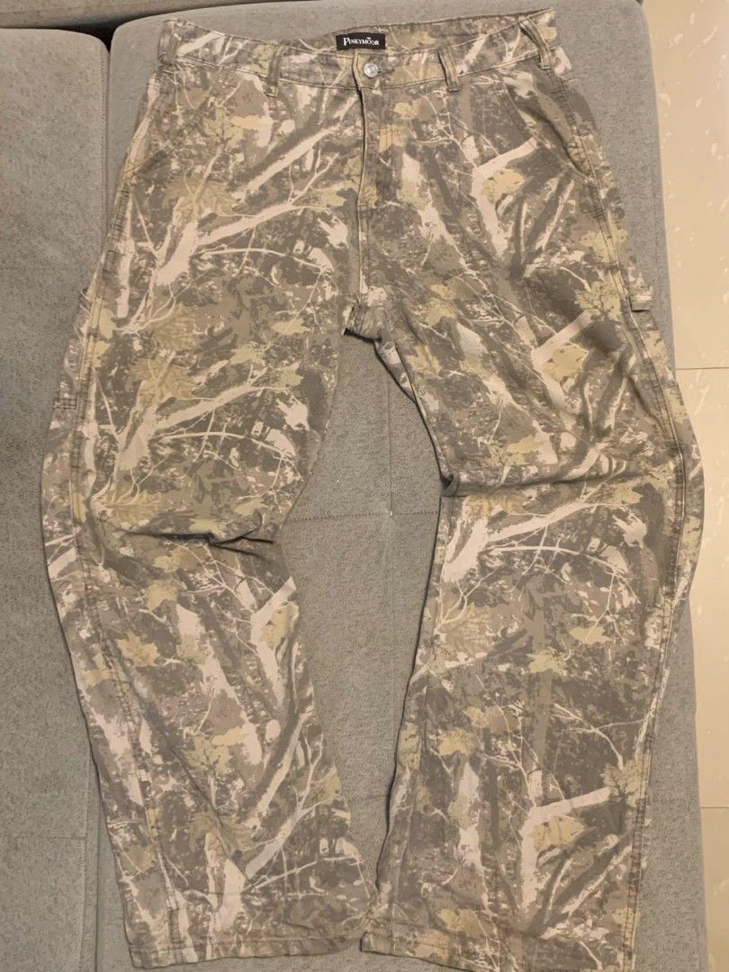 PINKYMOOR Camouflage Cargo Pants (Category: Jeans) located in Caloocan City. Submitted by wakuseiiii (Listing ID 1462465278, Image 2). Description: - Brand: PINKYMOOR - Style: Classic Cargo Pants - Pattern: Camouflage (Grey, White, Light Green) - Closure: Button and Zip Front - Features: Multiple pockets - Ideal for: Casual wear, outdoor activities.