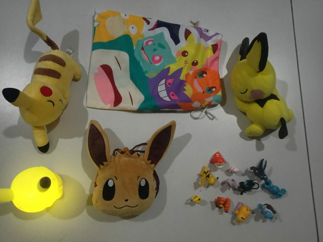 Pokemon Pikachu, Eevee Plushies & Mini Figurines Set (Category: Plushies & Soft Toys) located in Manila. Submitted by gencomanila (Listing ID 1462508813, Image 3). Description: - Bundle includes: 2 Pikachu plushies, 1 Eevee pouch, 1 Pikachu night light - Also includes a collection of mini Pokemon figurines - Ideal for any Pokemon fan or collector.