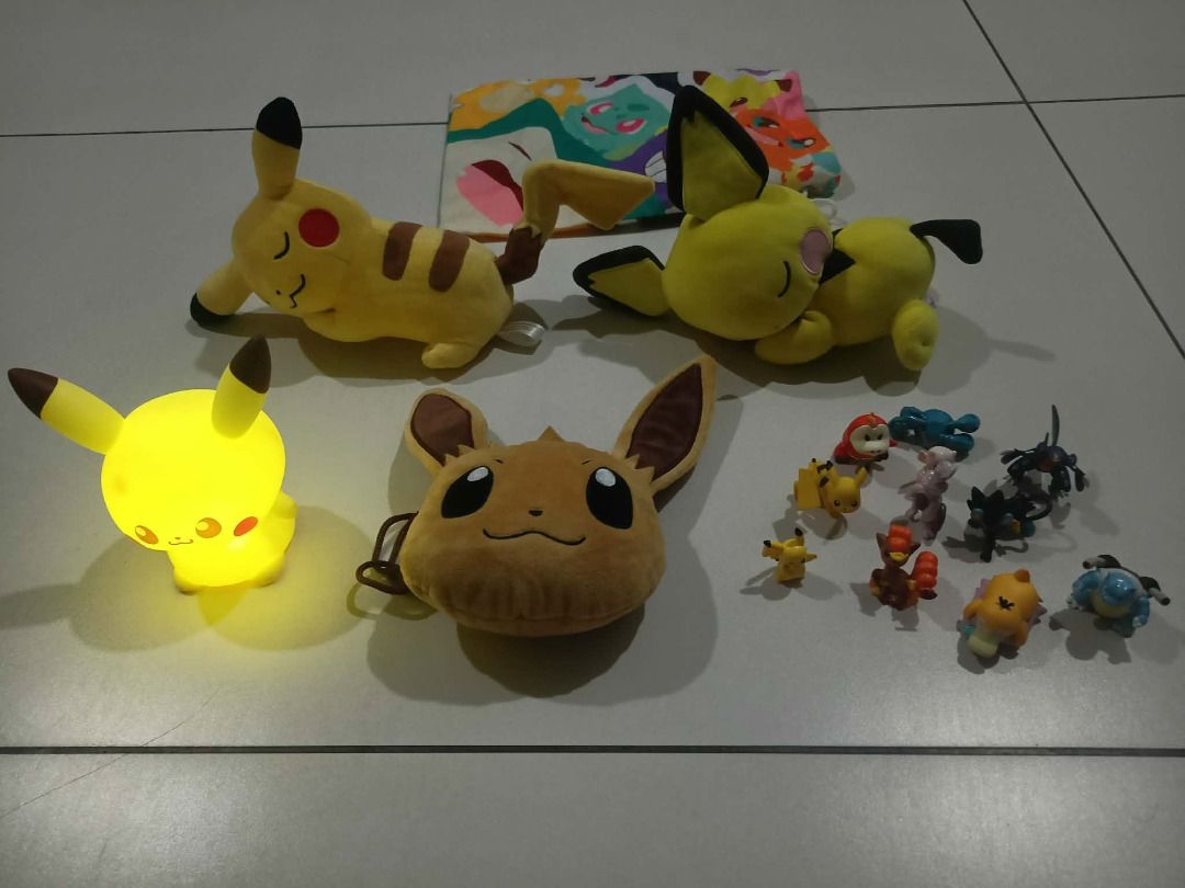Pokemon Pikachu, Eevee Plushies & Mini Figurines Set (Category: Plushies & Soft Toys) located in Manila. Submitted by gencomanila (Listing ID 1462508813, Image 2). Description: - Bundle includes: 2 Pikachu plushies, 1 Eevee pouch, 1 Pikachu night light - Also includes a collection of mini Pokemon figurines - Ideal for any Pokemon fan or collector.