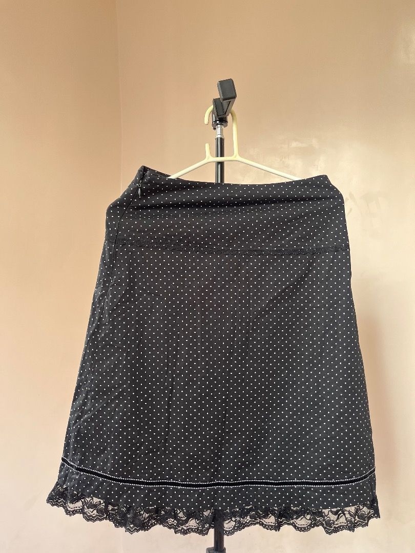 Polka dot top and midi skirt (Category: Sleeveless) located in Caloocan City. Submitted by luvv.kryx (Listing ID 1462498381, Image 1). Description: - Adorable yellow camisole top - Features a charming white polka dot pattern - Delicate lace trim around the neckline - Decorative tie detail at the front - Adjustable spaghetti straps for a perfect fit - Versatile for layering or wearing as a standalone piece.