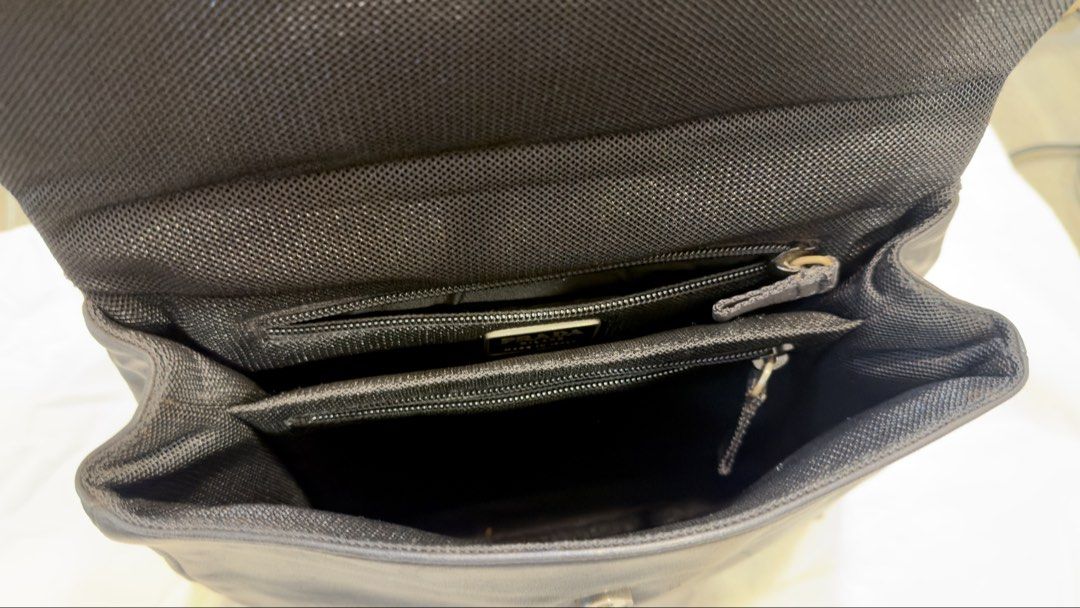Prada Black Leather Handbag with Silver Buckle (Category: Luxury Bags & Wallets) located in Calamba. Submitted by doublegm (Listing ID 1462591035, Image 2). Description: - Authentic Black Leather Prada Handbag - Made in Italy - Main compartment with internal zip pockets - Silver buckle flap closure - Interior is clean - Minor signs of wear on leather and buckle consistent with use - Ideal for everyday carry.