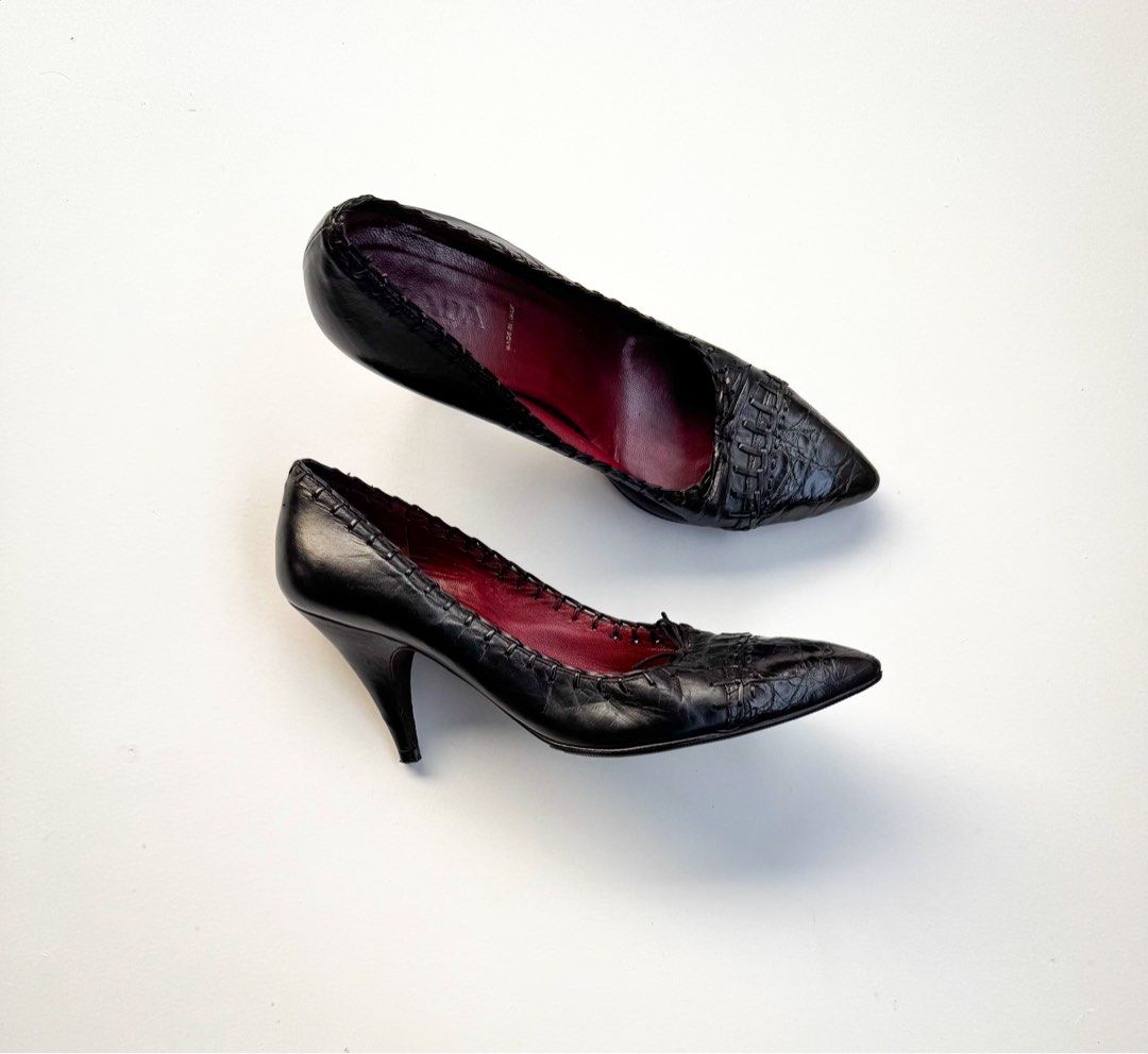 Prada Black Leather Woven Pointed Toe Heels (Category: Heels) located in Davao. Submitted by LUXURY (Listing ID 1462547267, Image 1). Description: Chic and classic black Prada heels. Made in Italy from leather with a woven toe detail and a stiletto heel. Features a red interior lining. Size 36 Pair obly Visit my profile for more luxury items.