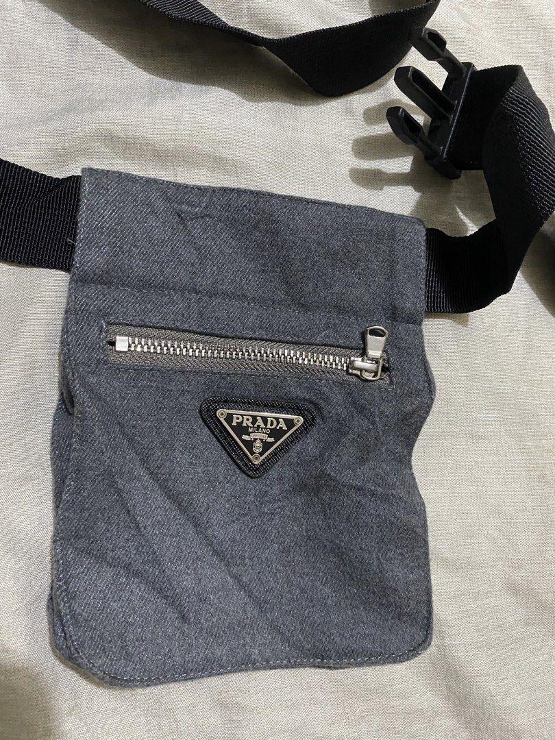 Prada Grey Canvas Waist Bag Belt Bag (Category: Luxury Bags & Wallets) located in Davao. Submitted by chazethrift (Listing ID 1462571113, Image 2). Description: - Grey canvas Prada waist bag - Front zippered pocket - Adjustable black strap with buckle closure - Small Prada logo triangle on the front - Ideal for keeping essentials easily accessible.