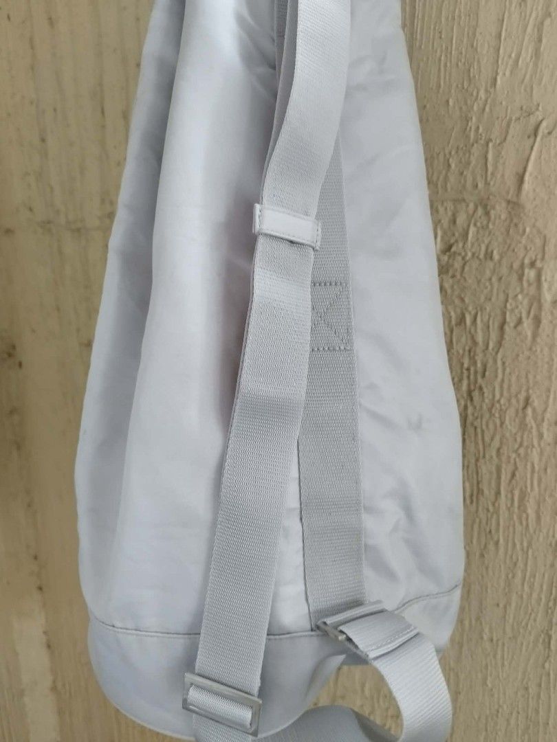 Prada Luna Rossa Drawstring Backpack (Category: Luxury Bags & Wallets) located in Las Pinas. Submitted by anggesmart (Listing ID 1462505041, Image 2). Description: - Authentic Prada Luna Rossa drawstring bag - Color: Light Grey - Adjustable straps for comfortable carrying - Spacious interior - Ideal for gym or travel -Needs cleaning.
