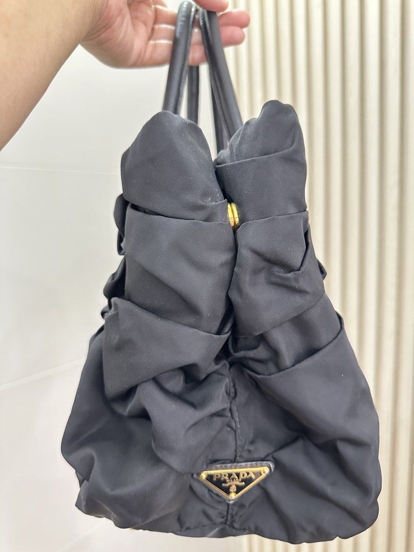 Prada Origami Tessuto Handbag (Category: Luxury Bags & Wallets) located in Pasig City. Submitted by tinafies (Listing ID 1462648920, Image 2). Description: Vintage and well-loved, comes with Prada card.