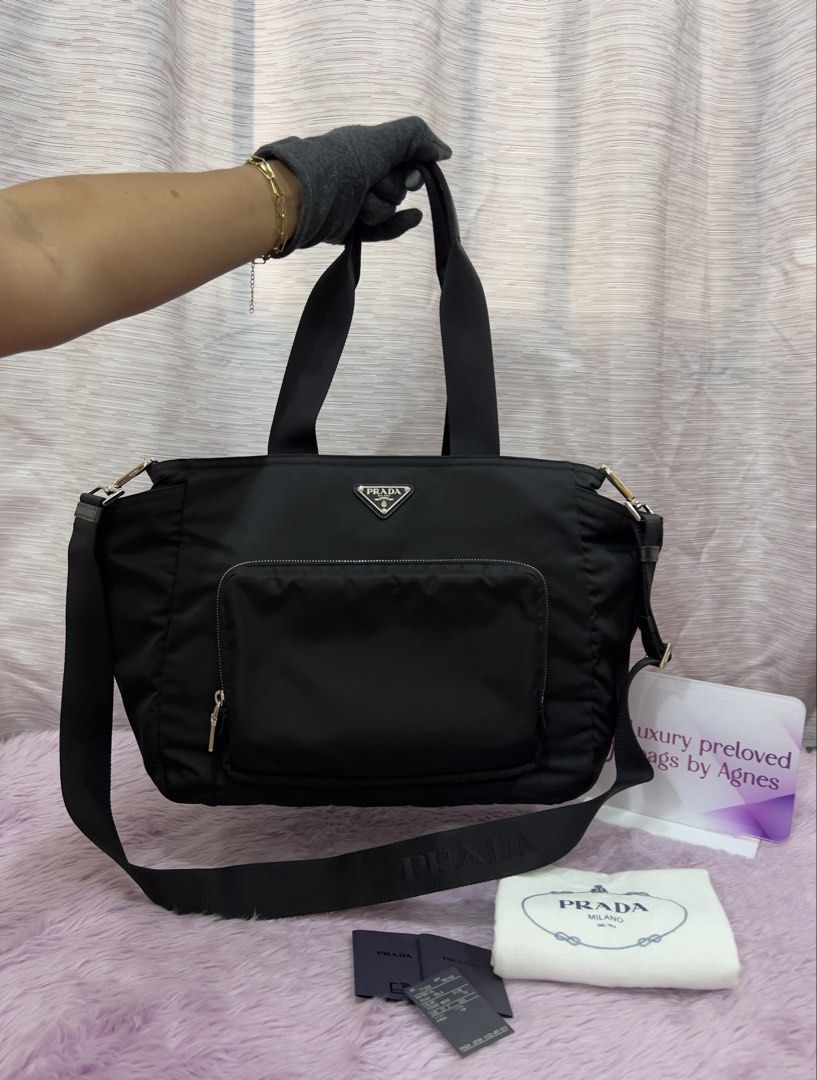 Prada Re-Nylon Changing Bag (Category: Luxury Bags & Wallets) located in Manila. Submitted by luxuryprelovedbagsby_by_agnes (Listing ID 1462498708, Image 1). Description: Prada Re-Nylon Changing Bag Php 65,000 150K SRP Excellent Condition Diaper Bag Travel Bag Dimensions: 36cm x 31cm x 18cm.