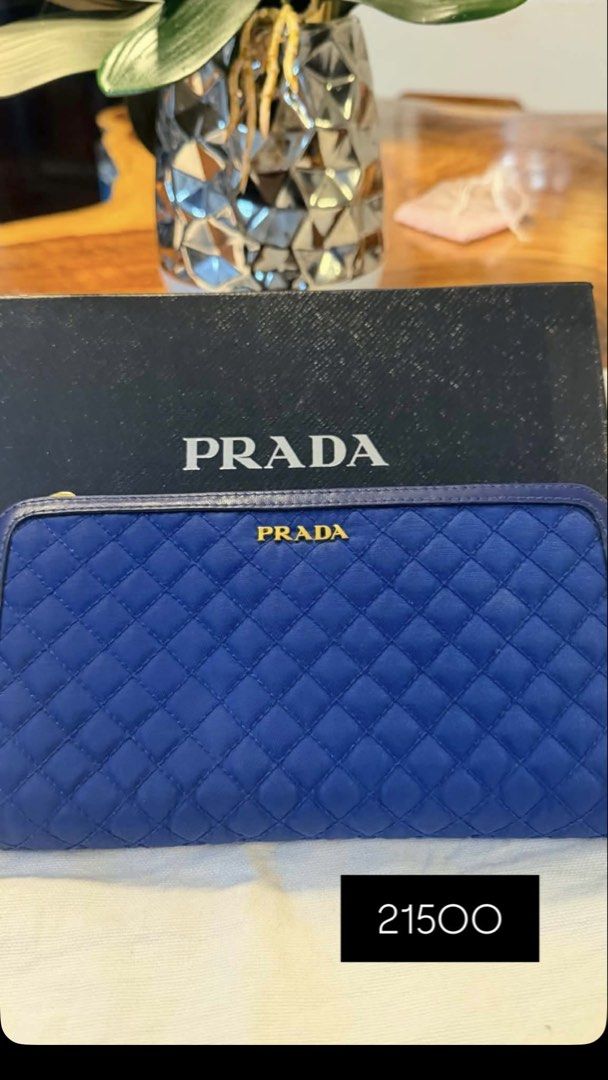 Prada Tessuto Quilted Zip-Around Wallet (Category: Luxury Bags & Wallets) located in Quezon City. Submitted by leens.preloved (Listing ID 1462627253, Image 1). Description: - Authentic Prada wallet - Vibrant blue quilted design - Gold Prada logo on front - Secure zip-around closure - Comes with original Prada box - Perfect for organizing essentials.