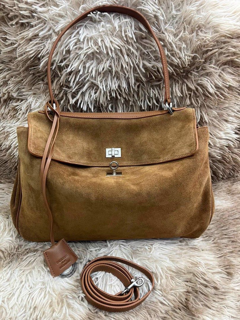 Preloved Rodeo Handbag Camel (Category: Luxury Bags & Wallets) located in Manila. Submitted by bagsandmanymanymore1 (Listing ID 1462586773, Image 3). Description: Preloved Balenciaga Rodeo Handbag -Camel color -Size 35cm and 40cm -Japan source🇯🇵 -Smooth calfskin and waxed suede -One Handle -Aged silver hardware -4 Brass Feet Can fit a smartphonr, a Book and Tablet Please read before you order 👉🏻❗️Payment first before shipping ❗️Cut off time o
