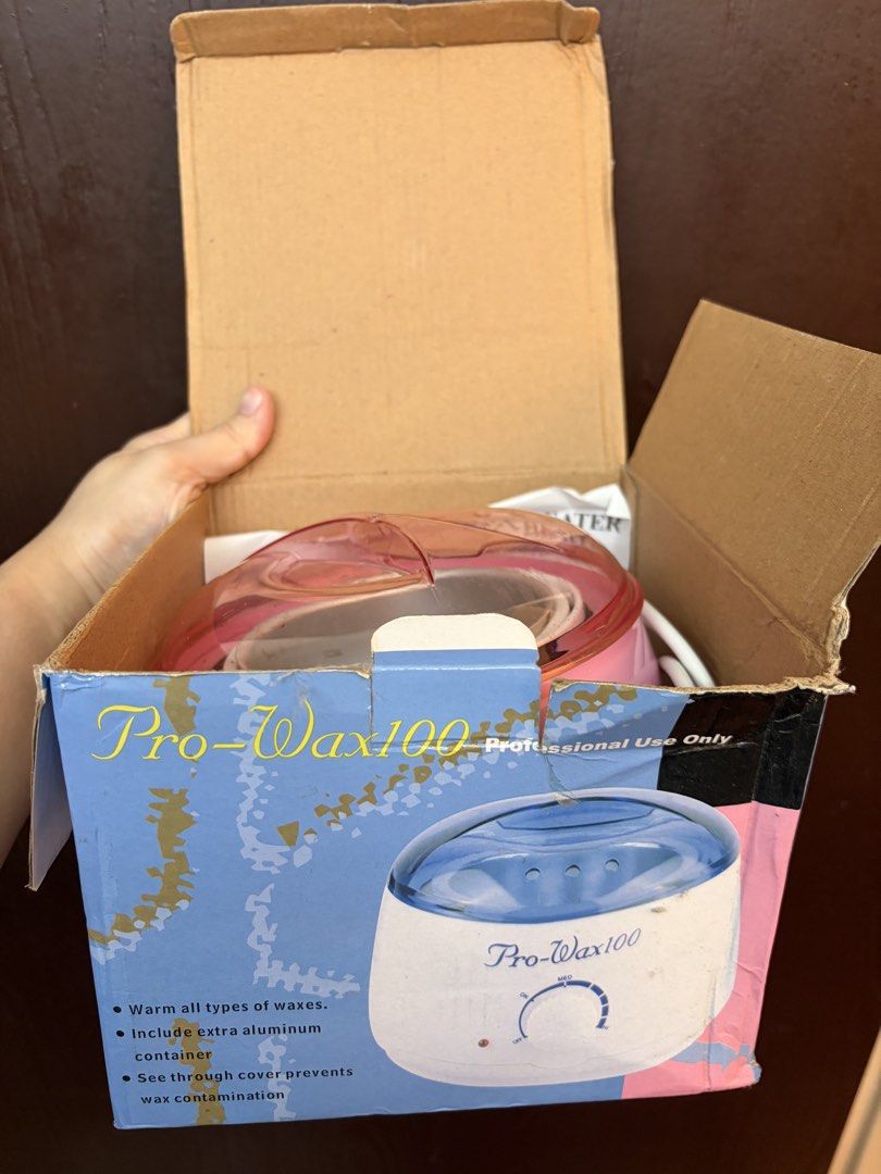 Pro-Wax100 Professional Wax Heater (Category: Hair) located in Balanga. Submitted by chirirai (Listing ID 1462615086, Image 2). Description: - Pro-Wax100 Wax Heater - Warms all types of waxes - Comes with an extra aluminum container - See-through cover - Ideal for professional salon use -Used only once -Rfs: Not using anymore, can’t remove the other wax residue -with free trial wax and Nanny rose, resdy to use wax expiring on November 2026 .