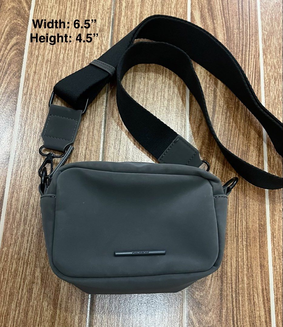 Pull&Bear Grey Crossbody Bag (Category: Cross-body Bags) located in Mandaue City. Submitted by piacatrina08 (Listing ID 1462450455, Image 1). Description: - Dimensions: 6.5" Wide x 4.5" High - Condition: has signs of fading due to storage.