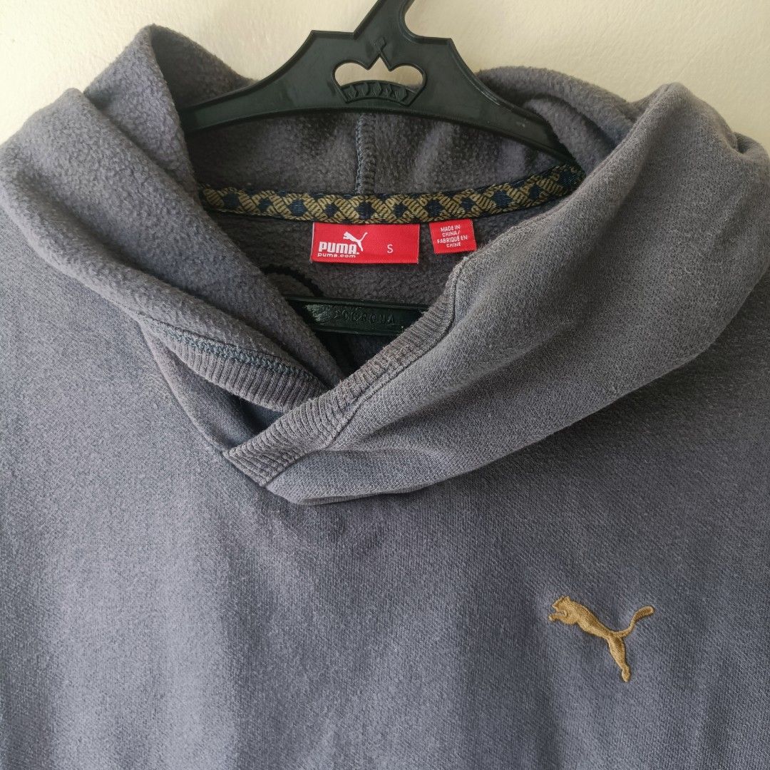 Puma Grey Hoodie Size S (Category: Hoodies) located in Pasig City. Submitted by prelovedbym33 (Listing ID 1462459876, Image 3). Description: - Classic grey Puma hoodie - Embroidered Puma logo on chest - Convenient front pocket - Adjustable drawstring hood - Soft and comfortable material - Ideal for casual wear.