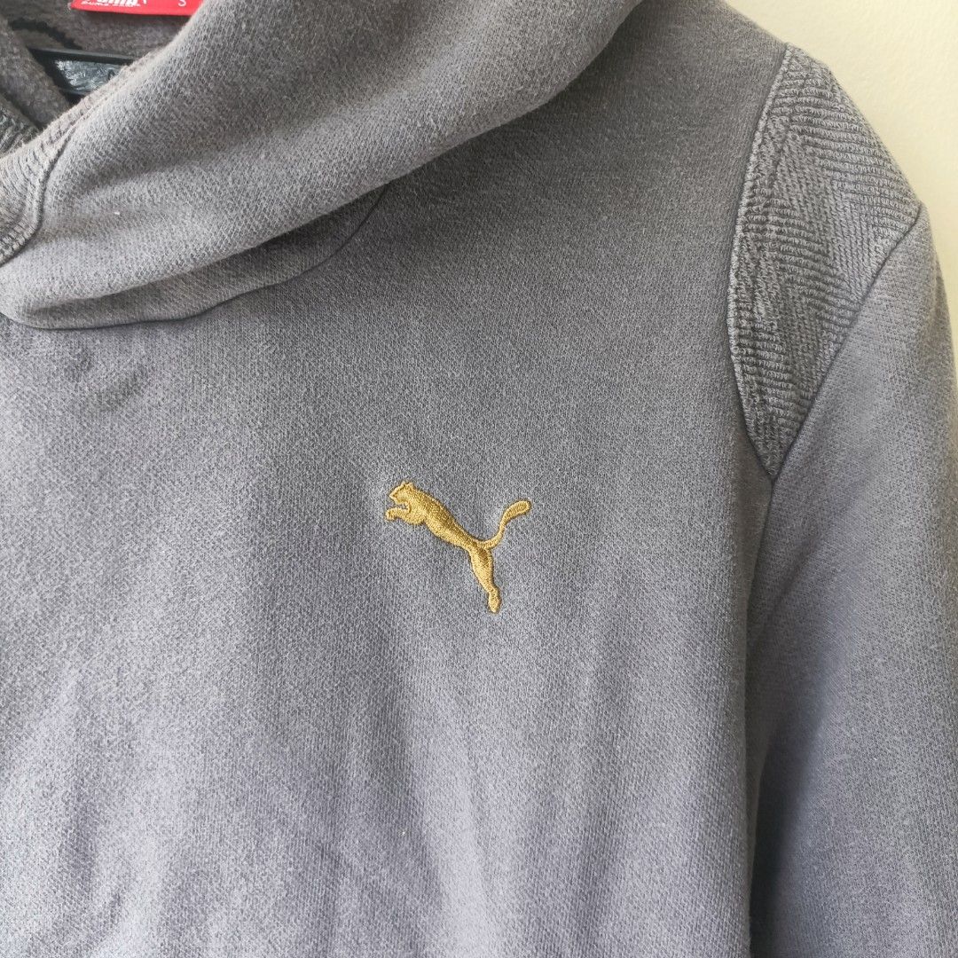 Puma Grey Hoodie Size S (Category: Hoodies) located in Pasig City. Submitted by prelovedbym33 (Listing ID 1462459876, Image 2). Description: - Classic grey Puma hoodie - Embroidered Puma logo on chest - Convenient front pocket - Adjustable drawstring hood - Soft and comfortable material - Ideal for casual wear.