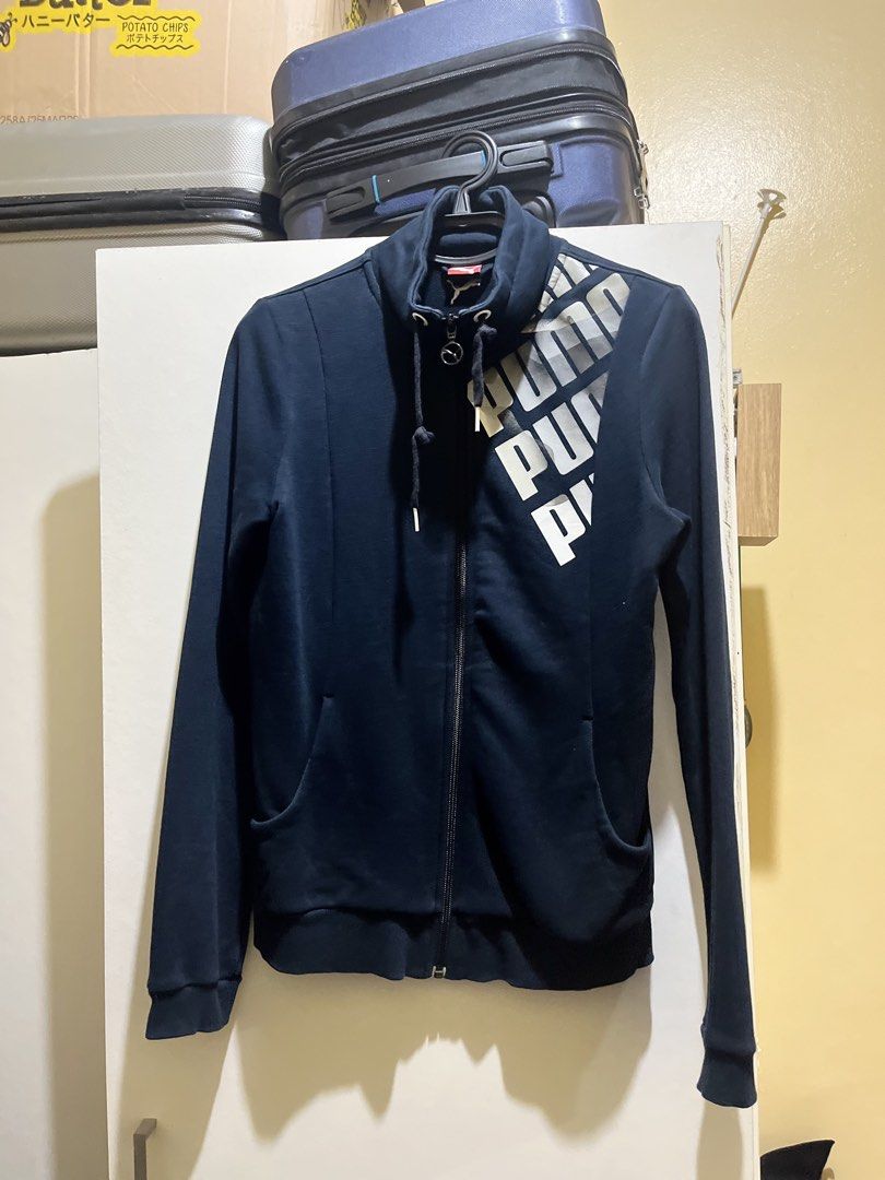 Puma Navy Blue Full Zip Jacket with Logo (Category: Coats, Jackets and Outerwear) located in Manila. Submitted by jezrathrift (Listing ID 1462673641, Image 1). Description: - Navy blue Puma jacket - Full zip closure - Puma logo on chest - Two side pockets - Ribbed cuffs and hem - Ideal for casual wear or light workouts.