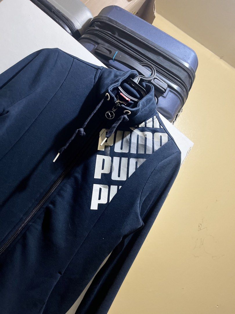 Puma Navy Blue Full Zip Jacket with Logo (Category: Coats, Jackets and Outerwear) located in Manila. Submitted by jezrathrift (Listing ID 1462673641, Image 2). Description: - Navy blue Puma jacket - Full zip closure - Puma logo on chest - Two side pockets - Ribbed cuffs and hem - Ideal for casual wear or light workouts.