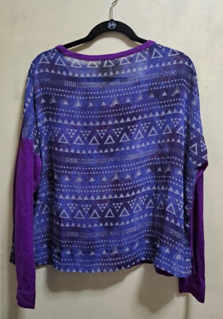 Purple Light Pullover Top (Category: Longsleeves) located in Manila. Submitted by thrifter_lifestyle (Listing ID 1462678720, Image 2). Description: Brand: Kirra (bought in Korea) Long-Sleeves Geometric print at the back, material is sheer almost see through (which makes in unique!) Photos show how it falls on shoulders Material: Acrylic knitted front, back is sheer polyester Actual Color: Borahae Purple 💜 No issues 😀 RFS: closet spring cleaning