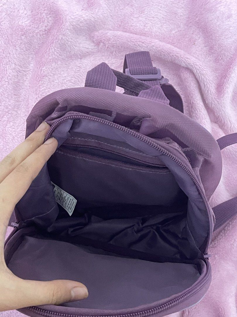 Purple Skechers Mini Backpack (Category: Backpacks) located in Manila. Submitted by boldflower.98829f (Listing ID 1462678906, Image 2). Description: - Cute purple mini backpack from Skechers - Features the iconic S logo on the front pocket - Includes a main compartment and a front zip pocket for organization - Adjustable straps for a comfortable fit - Ideal for everyday use or travel adventures.