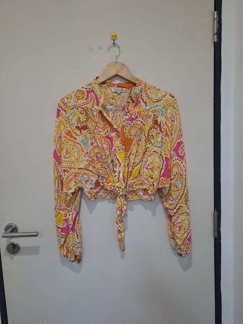 Rachel Zoe crop (Category: Others Tops) located in Mandaluyong City. Submitted by epicowl-c93c (Listing ID 1462582134, Image 1). Description: This item is a Rachel Zoe Paisley Tie-Front Cropped Blouse, a lightweight bohemian-style garment known for its vibrant yellow, pink, and orange color palette.