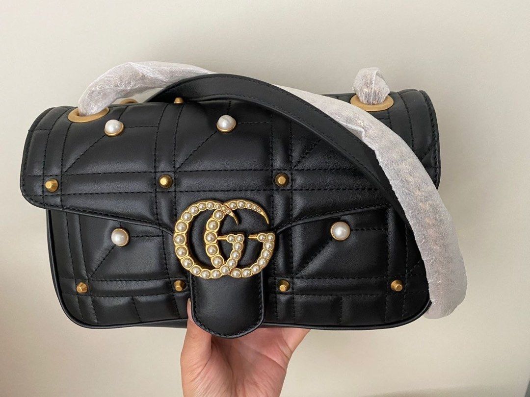 RARE Authentic Gucci Marmont Small with Pearls (Category: Luxury Bags & Wallets) located in Cebu City. Submitted by tala10 (Listing ID 1462461360, Image 1). Description: Marked down from 60k to 57k! Rare and unique authentic Gucci Marmont bag in small size with pearl embellishments. Only used twice so it’s actually still very pristine and looks brand new. The black leather and pearl combo for the Marmont is unique but still classic at the same ti