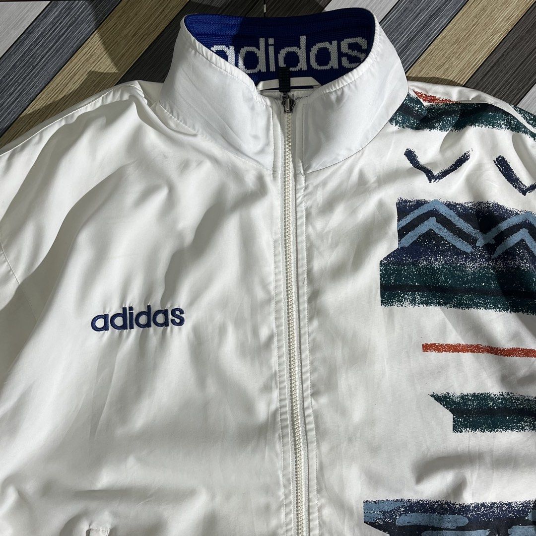 RARE!! Vintage Adidas Asymmetrical Geometric Pattern Windbreaker (Category: Coats, Jackets and Outerwear) located in Daraga. Submitted by th3cliquejunks (Listing ID 1462647647, Image 3). Description: RARE!! Vintage Adidas Asymmetrical Geometric Pattern Windbreaker Tagged Size: Large Condition: 9/10 Signs of usage. No major flaw Loose ribbings Measurement: Pit to pit: 23” Length: 26-27” - 3,000 Dm!.