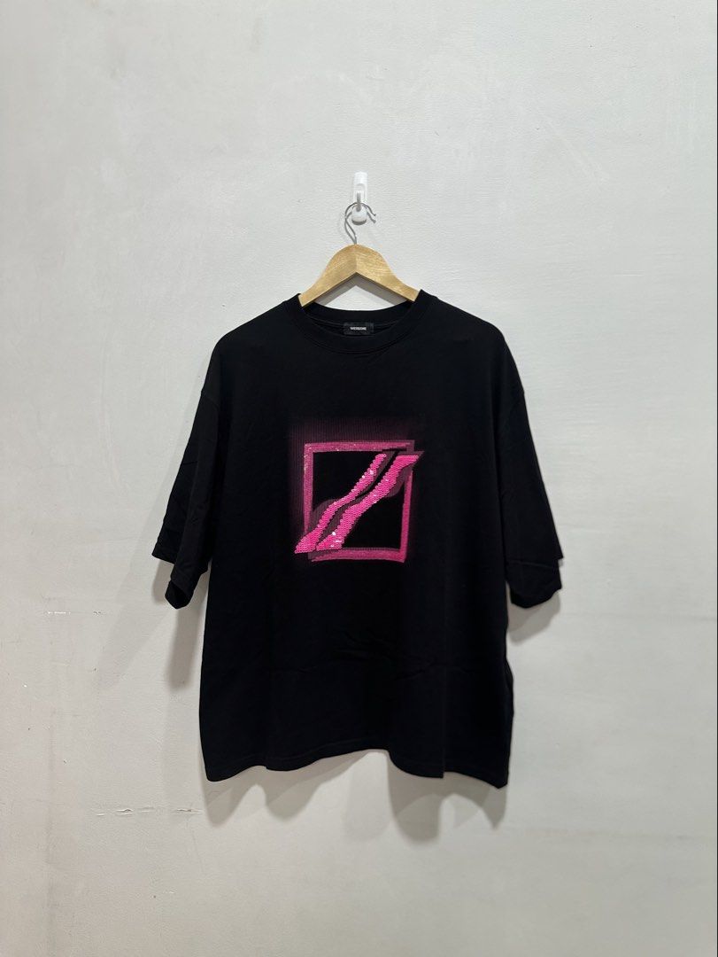 Rare WE11DONE Sequin Logo Graphic Tee Black L (Authentic) (Category: Tshirts & Polo Shirts ) located in Manila. Submitted by ylsrarities (Listing ID 1462538689, Image 1). Description: Features a bold pink sequin WE11DONE graphic on the front with a subtle rubberized WE11DONE logo patch near the lower back. • Size L • Black • 100% Cotton • Pink sequin graphic • Rubberized logo patch at lower back • Crewneck • Short sleeves • Oversized / relaxed bo