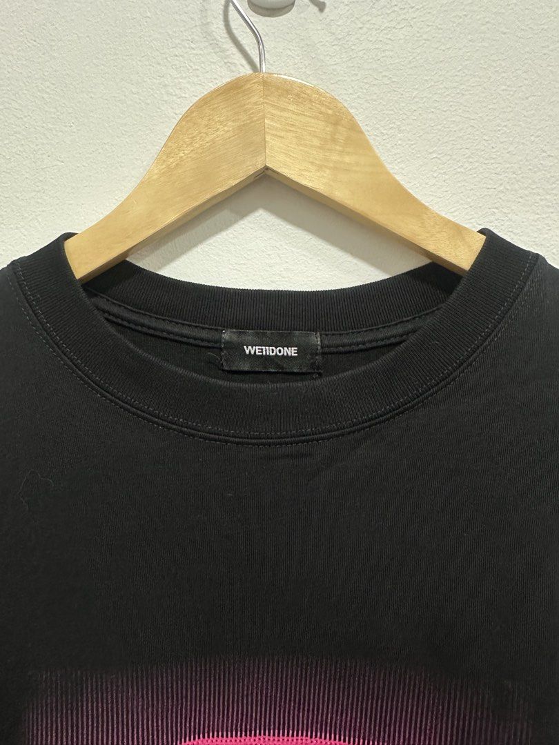 Rare WE11DONE Sequin Logo Graphic Tee Black L (Authentic) (Category: Tshirts & Polo Shirts ) located in Manila. Submitted by ylsrarities (Listing ID 1462538689, Image 3). Description: Features a bold pink sequin WE11DONE graphic on the front with a subtle rubberized WE11DONE logo patch near the lower back. • Size L • Black • 100% Cotton • Pink sequin graphic • Rubberized logo patch at lower back • Crewneck • Short sleeves • Oversized / relaxed bo