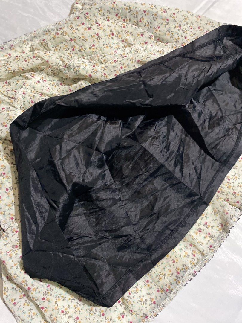 Layered Floral Midi Skirt (Category: Activewear) located in Paranaque City. Submitted by kuweefindsmnl (Listing ID 1462606545, Image 3). Description: - Adorable tiered midi skirt - Pretty grayish floral print - Black lace trim on each tier - Comfortable elasticated waistband - Waist: 26"-38" - Length: 17" - Includes black lining - Ideal for cottagecore or fairy kei aesthetics.