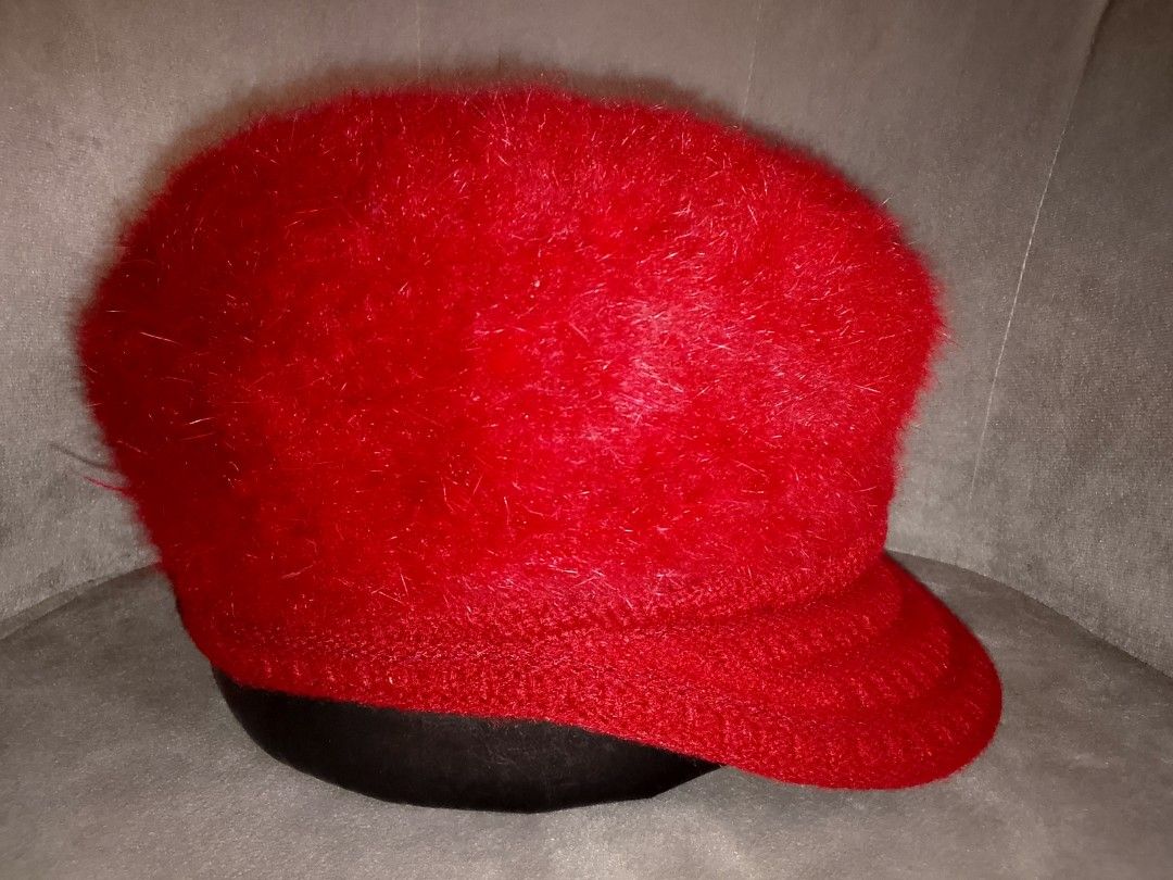 Red Fuzzy Cabbie Hat with Ribbed Knit Visor (Category: Hats & Beanies) located in Binangonan. Submitted by yuristalin888 (Listing ID 1462661795, Image 3). Description: This bright red hat features a voluminous, fuzzy crown with a soft, hair-like texture. The cap contrasts this fluffy upper with a structured front brim and lower band made from a ribbed knit material. As shown in the side profile from the combination of the high-texture body and th