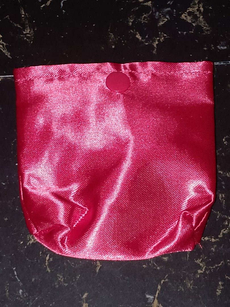 Red Satin Pouch with Snap Button (Category: Purses & Pouches) located in Manila. Submitted by perapern (Listing ID 1462597240, Image 1). Description: - Small red pouch made of satin - Features a snap button closure - Beautiful fabric sheen - Ideal for storing jewelry, coins, or makeup - Compact and easy to carry.