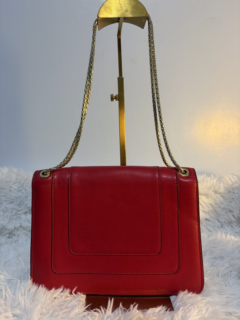 Red two way bag (Category: Cross-body Bags) located in Goa. Submitted by zahar_modern_thrift_bags001 (Listing ID 1462638105, Image 2). Description: In good condition .