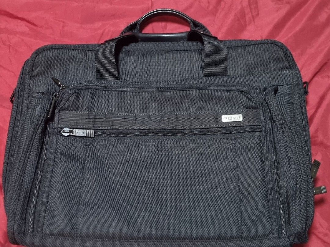 RIOVE Black Laptop Bag / Briefcase (Category: Briefcases) located in Manila. Submitted by ags028705 (Listing ID 1462599460, Image 1). Description: - Black RIOVE laptop bag - Multiple pockets for organization - Main compartment and front zippered pockets - Top handles and detachable shoulder strap - Ideal for work or travel - Fits laptop and other essentials.
