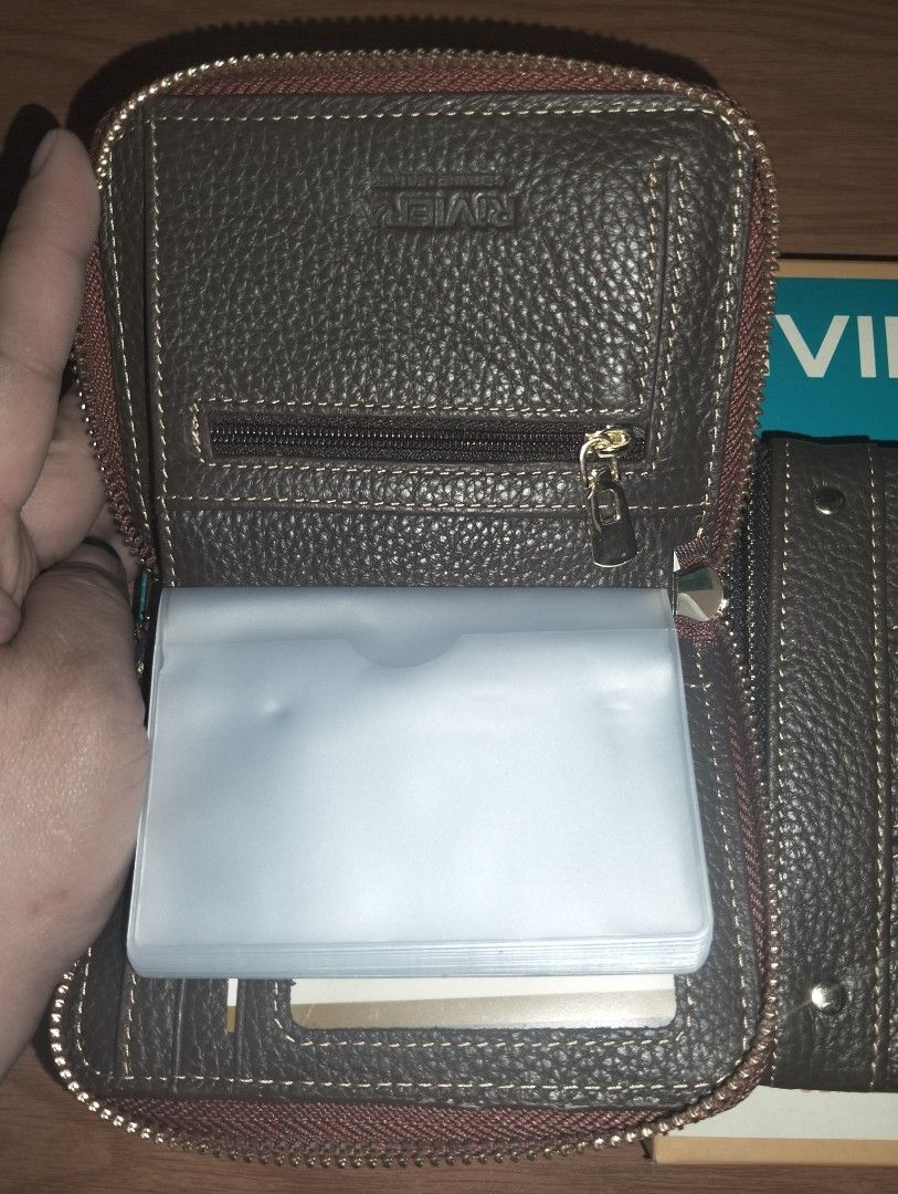 Riviera Genuine Leather Short Wallet (Category: Wallets & Card holders) located in Caloocan City. Submitted by girlshopmcollection (Listing ID 1462644484, Image 3). Description: - Two Riviera genuine leather wallets available: 1 Brown, 1 Dark - Both feature secure zippers and multiple card slots for organization. - The brown wallet includes a convenient card holder insert. - Ideal for keeping your cash and cards neatly organized. - Both wallets c