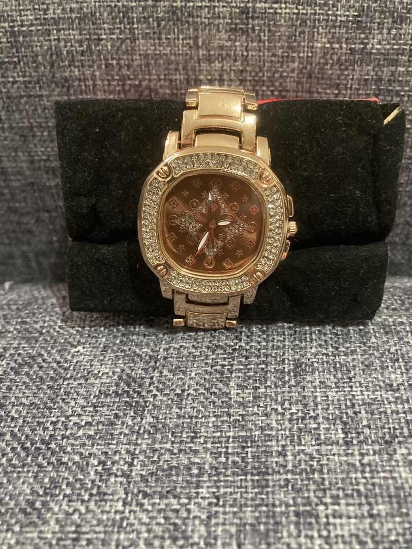 Rose Gold Watch with Diamond Bezel (Category: Women's Watches) located in Valenzuela. Submitted by theaveqc04360 (Listing ID 1462594296, Image 1). Description: - Elegant rose gold watch - Unique starburst pattern on the watch face - Bezel encrusted with small, sparkling stones - Matching rose gold band - A chic accessory to dress up any look.