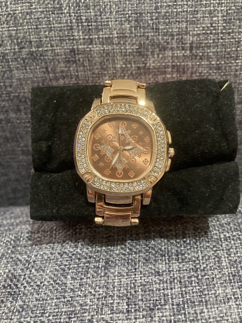 Rose Gold Watch with Diamond Bezel (Category: Women's Watches) located in Valenzuela. Submitted by theaveqc04360 (Listing ID 1462594296, Image 2). Description: - Elegant rose gold watch - Unique starburst pattern on the watch face - Bezel encrusted with small, sparkling stones - Matching rose gold band - A chic accessory to dress up any look.