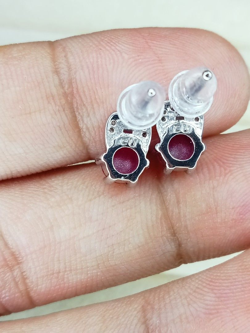 Ruby and silver 925 (hook)Amethyst Drop Earrings Set (Category: Earrings) located in Davao. Submitted by kimpoycaye62726 (Listing ID 1462648732, Image 2). Description: - Set of two pairs of earrings - Pair 1: Round red stones with small clear accent stones - Pair 2: Pear-shaped purple stones - Both feature S925 sterling silver hooks - Versatile for dressing up or everyday wear - Selling as a set.