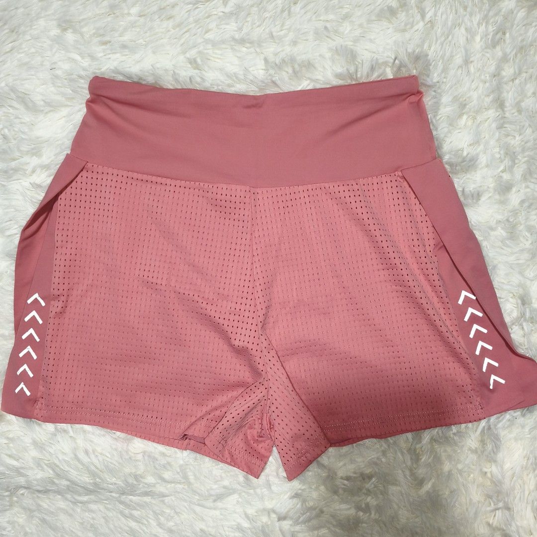 Running or Active short (Category: Activewear) located in Antipolo. Submitted by alphaomega_fox (Listing ID 1462568150, Image 1). Description: - Pink athletic shorts - High-waisted fit - Perforated design for enhanced breathability - White chevron detail on the sides - Versatile for workouts or casual wear - Comfortable and stylish 26-34x13 300 plus sf.