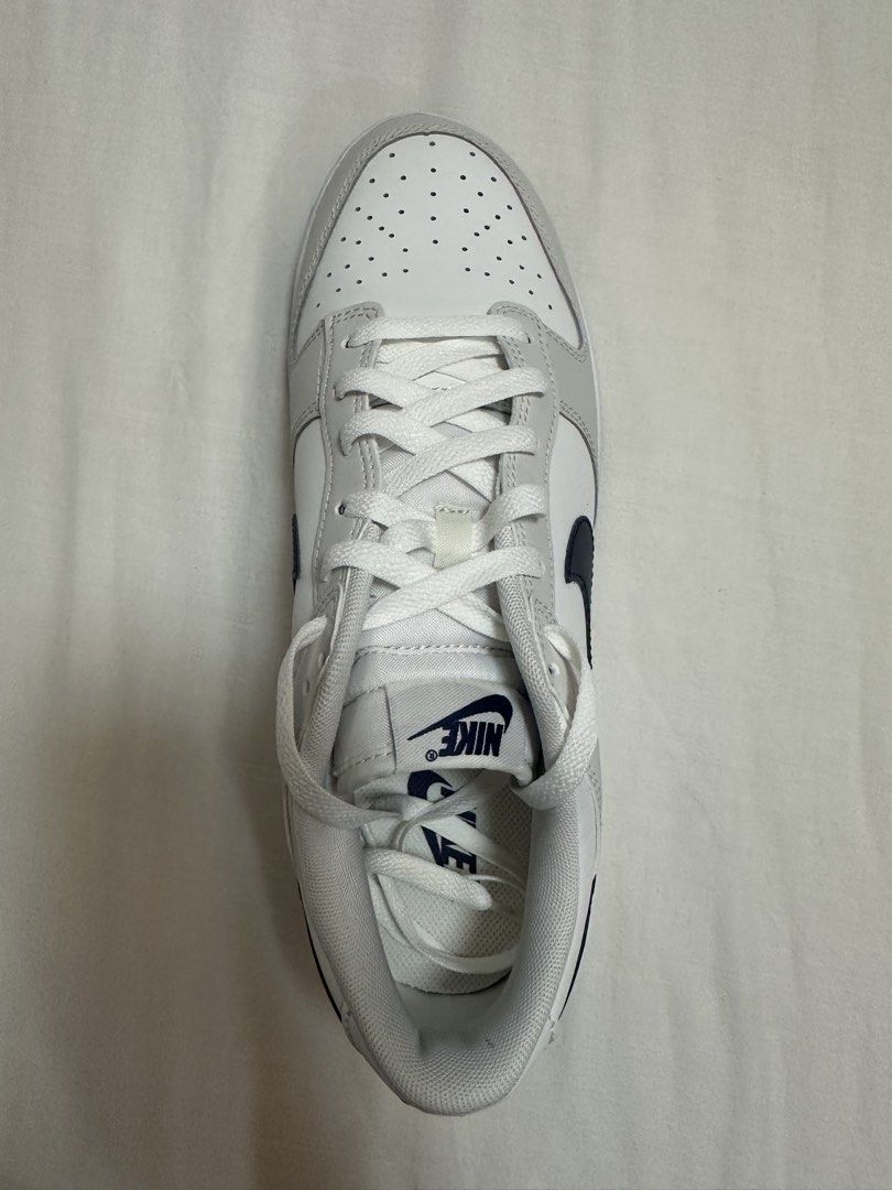 RUSH SALE Nike Dunk Low White Grey Navy (Category: Sneakers) located in Taguig. Submitted by lga05 (Listing ID 1462453659, Image 2). Description: - Classic Nike Dunks bought from US - White and grey colorway with navy accents - Low-top silhouette - White laces - White soles with navy stripe - Ideal for everyday wear.