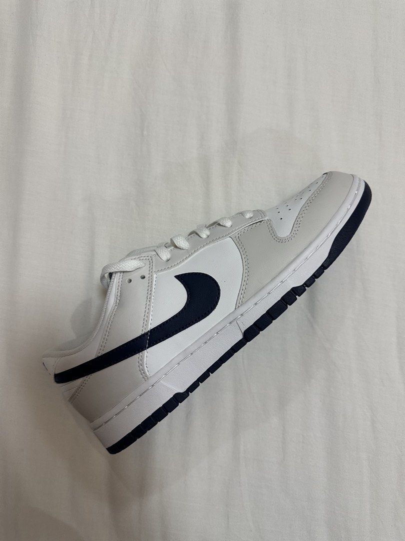 RUSH SALE Nike Dunk Low White Grey Navy (Category: Sneakers) located in Taguig. Submitted by lga05 (Listing ID 1462453659, Image 1). Description: - Classic Nike Dunks bought from US - White and grey colorway with navy accents - Low-top silhouette - White laces - White soles with navy stripe - Ideal for everyday wear.