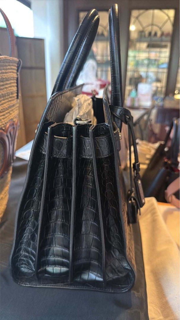 Saint Laurent Sac De Jour Bag (Category: Luxury Bags & Wallets) located in Manila. Submitted by kenmalabuyoc29 (Listing ID 1462442823, Image 3). Description: - Authentic Saint Laurent Sac De Jour bag - Color: Black - Material: Croc-embossed leather - Features: Top handles, detachable shoulder strap - Hardware: Silver - Interior: Clean - Versatile: Ideal for work or evening wear - Style: Classic piece.