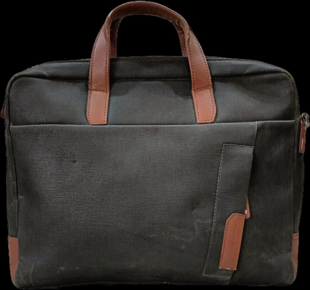 Samsonite RED Laptop Bag Messenger Bag (Category: Sling Bags) located in Zamboanga. Submitted by tenshiqt (Listing ID 1462679887, Image 2). Description: - Preloved Samsonite RED laptop bag - Color: Dark grey canvas with brown leather accents - Features multiple compartments for organization - Ideal for work or school - Please manage expectations for a preloved item.