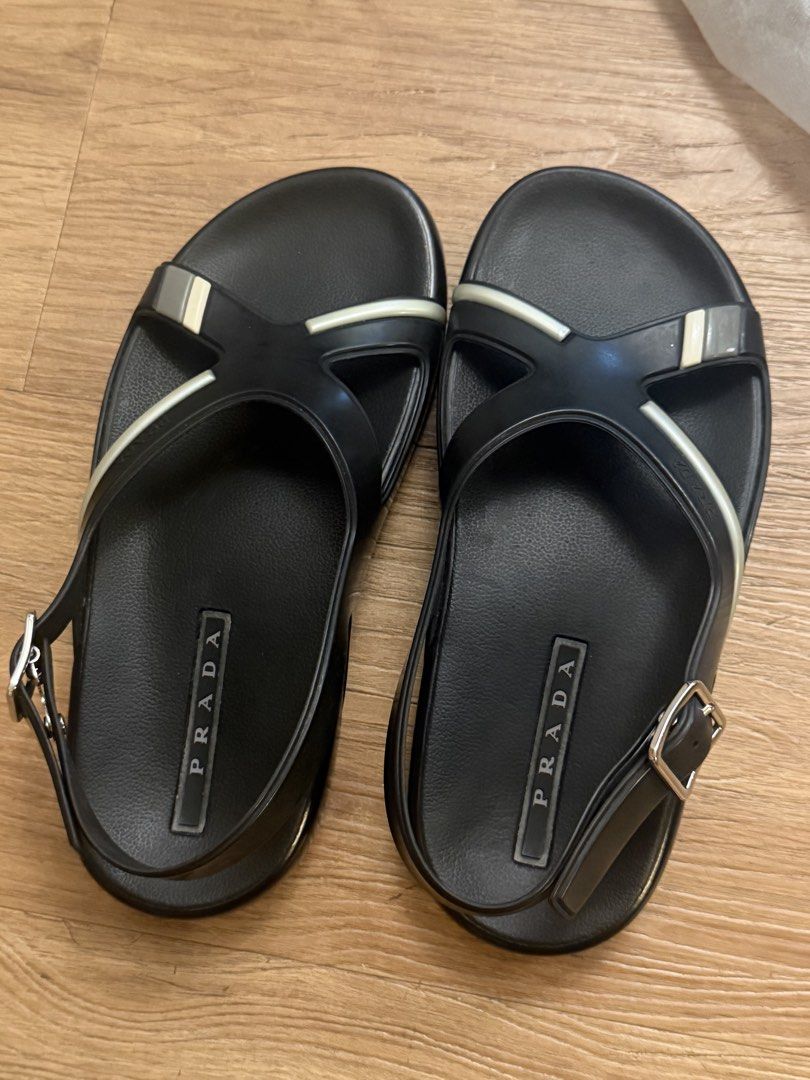 Sandals Prada (Category: Sneakers & Footwear) located in Taguig. Submitted by saritsarishop (Listing ID 1462478403, Image 1). Description: Bought in Japan 🇯🇵 Prada Sandals 👡 RAnk Good AB Unused item JUst the sandals no box, just provided dustbag as what posted in the picture. Narrow sa dulo ng paa i suggest narrow feet din To wear this correct size naman siya Need e adjust one size smaller if medyo malapad feet 👣 better not Size 8.5 US/26.5/4