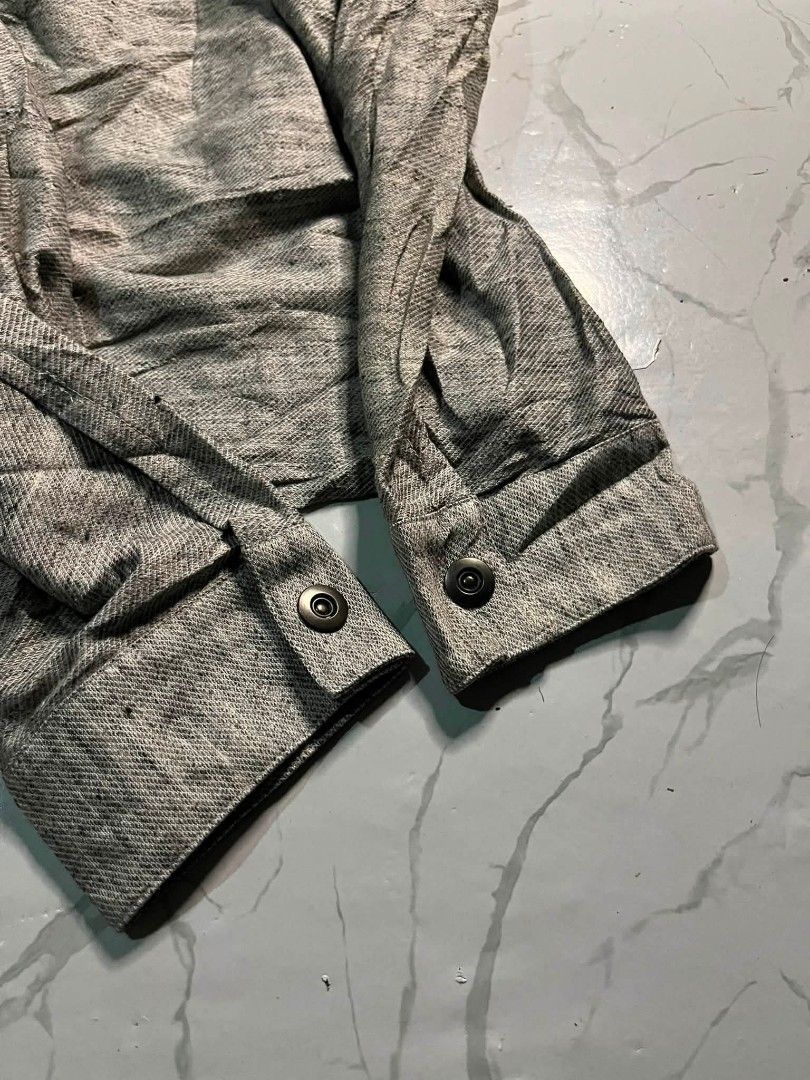 Schlüssel Jacket Size 3 Grey Textured Button Up (Category: Coats, Jackets and Outerwear) located in Zamboanga. Submitted by 2ndabubazir (Listing ID 1462670761, Image 3). Description: - Grey textured jacket from Schlüssel - Button-up front with a unique collar - Long sleeves with button cuffs - Made in Japan - Size 3 Dimensions L26 W 18 SL25 - Ideal for layering or as a light jacket.