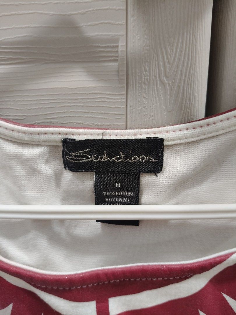 Seductions Red and White Geometric Print Tank Top Size M (Category: Sleeveless) located in Manila. Submitted by hellocaea010894 (Listing ID 1462601340, Image 2). Description: - Seductions Tank Top - Size: Medium (M) - Design: Red and white geometric print - Sleeveless - Material: 70% Rayon - Perfect for casual wear.