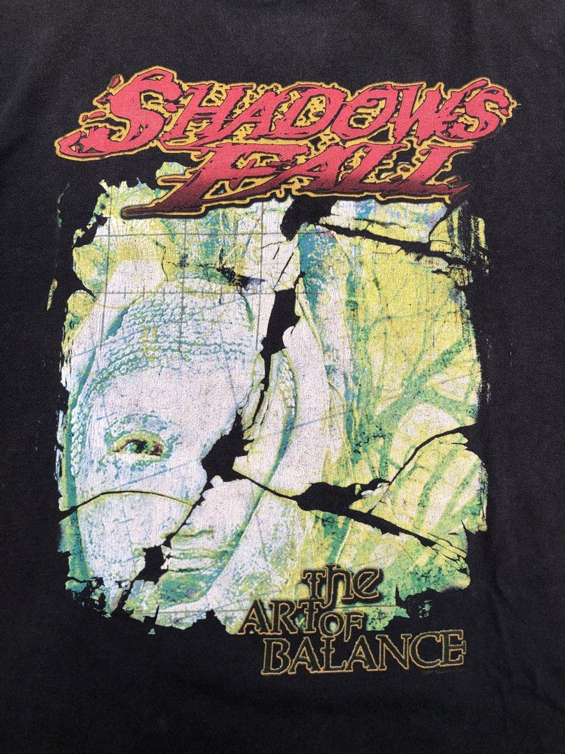 shadow fall (Category: Tshirts & Polo Shirts ) located in Manila. Submitted by thrift_neo (Listing ID 1462612546, Image 3). Description: Shadows Fall “The Art of Balance” vintage heavy metal Band from 2002 Delta pro weight tag size L on tag dimes 22x28.5 issue: uneven fading,nail holes,minimal sun fade on neck.