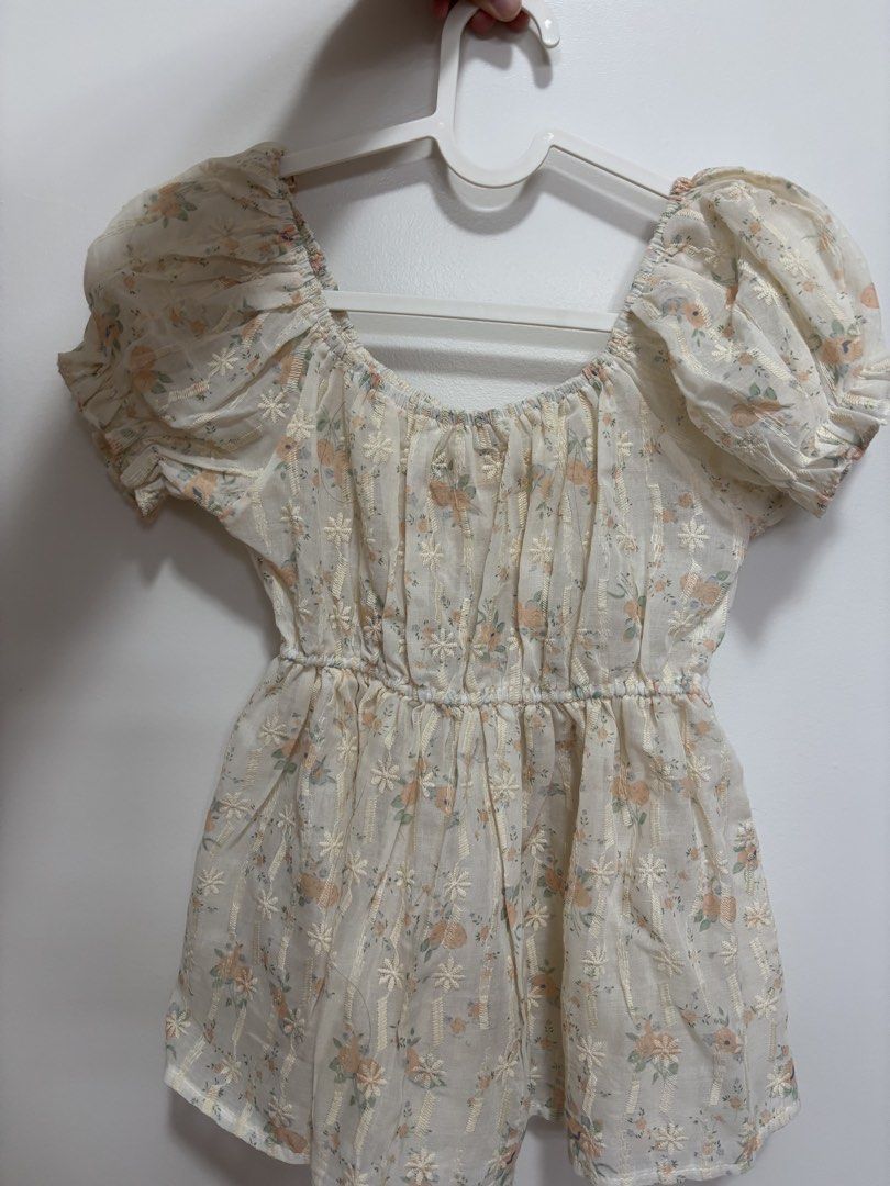 Sheer Floral Puff Sleeve Top with Tie Front (Category: Blouses) located in Quezon City. Submitted by janahvilla37434 (Listing ID 1462477330, Image 1). Description: - Cream sheer top - Delicate floral print - Puff sleeves - Gathered waist - Tie front detail - Lightweight and airy fabric - Perfect for layering or wearing solo.