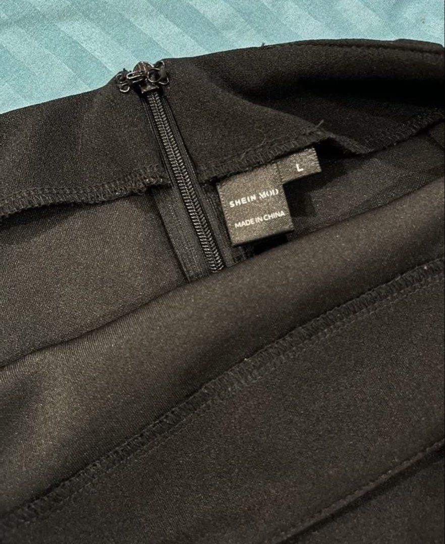 SHEIN MOD Black Mini Skirt Size L (Category: Skirts) located in Las Pinas. Submitted by francesaly (Listing ID 1462558505, Image 2). Description: - SHEIN MOD Black Mini Skirt - Side zipper for easy wear - Flattering cut - Small slits on the sides of the hem - Versatile for casual or dressed-up looks - Easy to pair with various tops - Made in China.