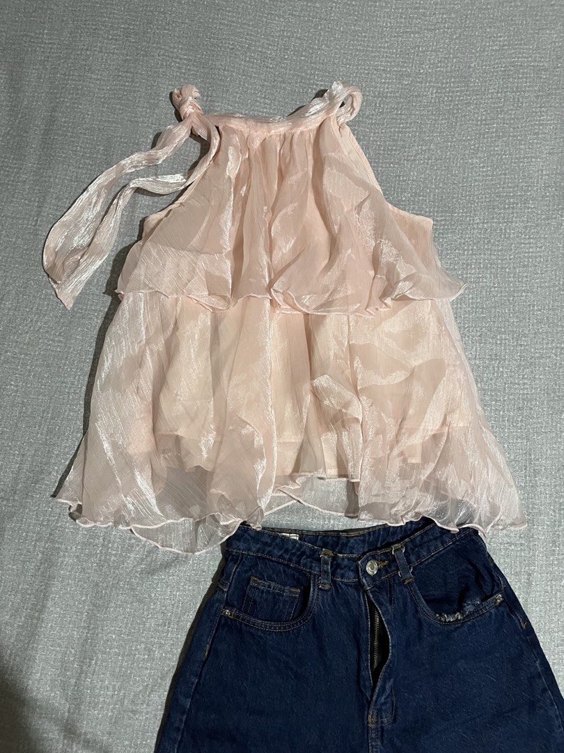 SHEIN Pink Organza Ruffle Top (Category: Sets or Coordinates) located in Manila. Submitted by az0r_ (Listing ID 1462504829, Image 2). Description: - Adorable pink organza top with charming ruffles and adjustable tie straps. - Top is from SHEIN, size Small (S). - Comes with a pair of stylish dark wash denim shorts. - Shorts are also size Small (S). - Ideal outfit for a casual day out or a fun beach trip. - Perfect summer combo for a trendy look..