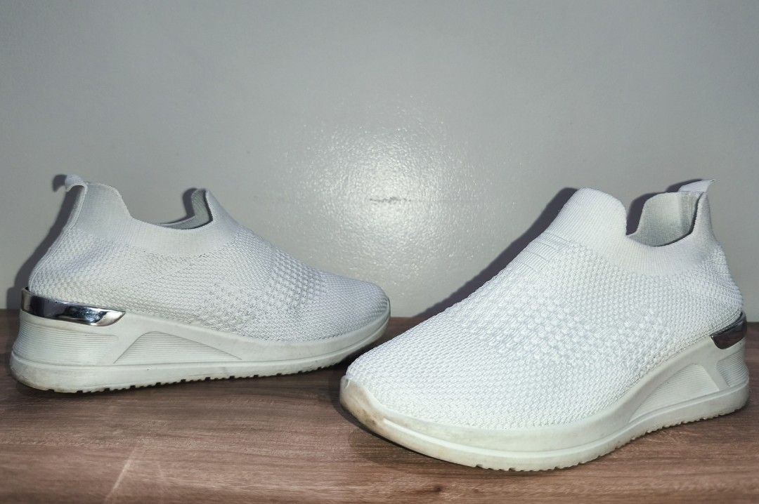 Shubizz White Wedge Shoes (38) (Category: Sneakers) located in Amadeo. Submitted by money.can.buy.happiness (Listing ID 1462618100, Image 3). Description: Mall Price: 1,299 Selling Price: 600 - Authentic - Size: US 38 - Color: White - Heel Height: Approx. 2 inches Issues: - Some stains - Some black markings on the metal parts Note: Also selling black version of this pair for the same price. Meet up at Skymart Manggahan.